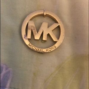 Michael Kohrs-handbag emblem